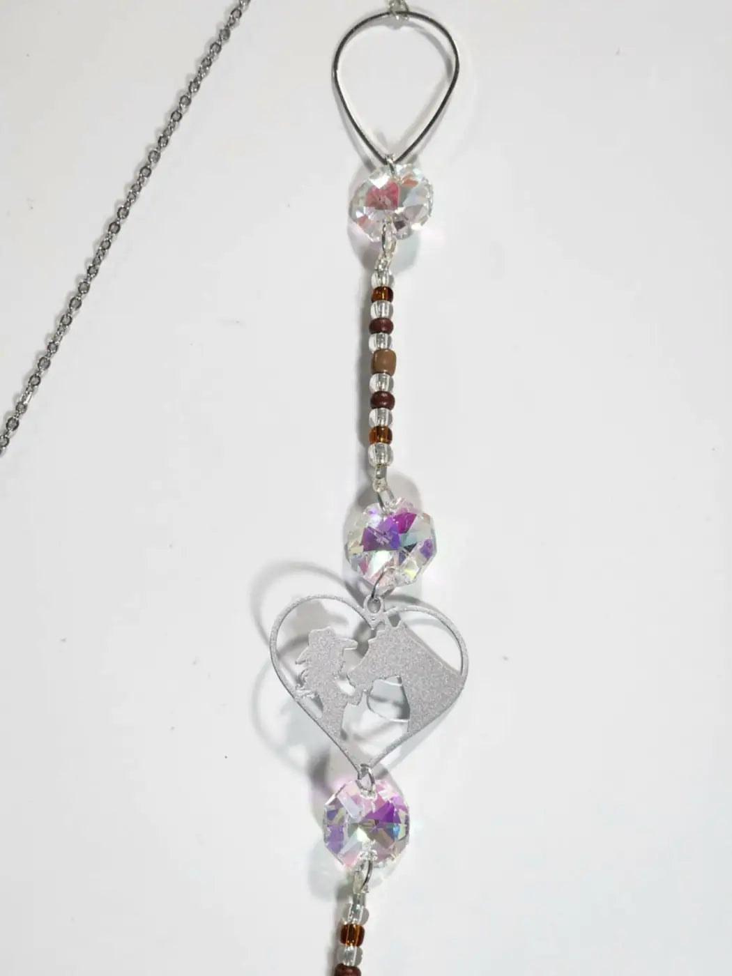Silver heart-shaped horse long suncatcher with iridescent crystals and small reflective light catcher beads