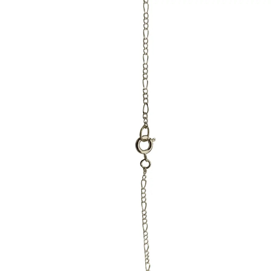 Silver-toned figaro chain with polished finish and lobster clasp featuring large clear beach glass pendant