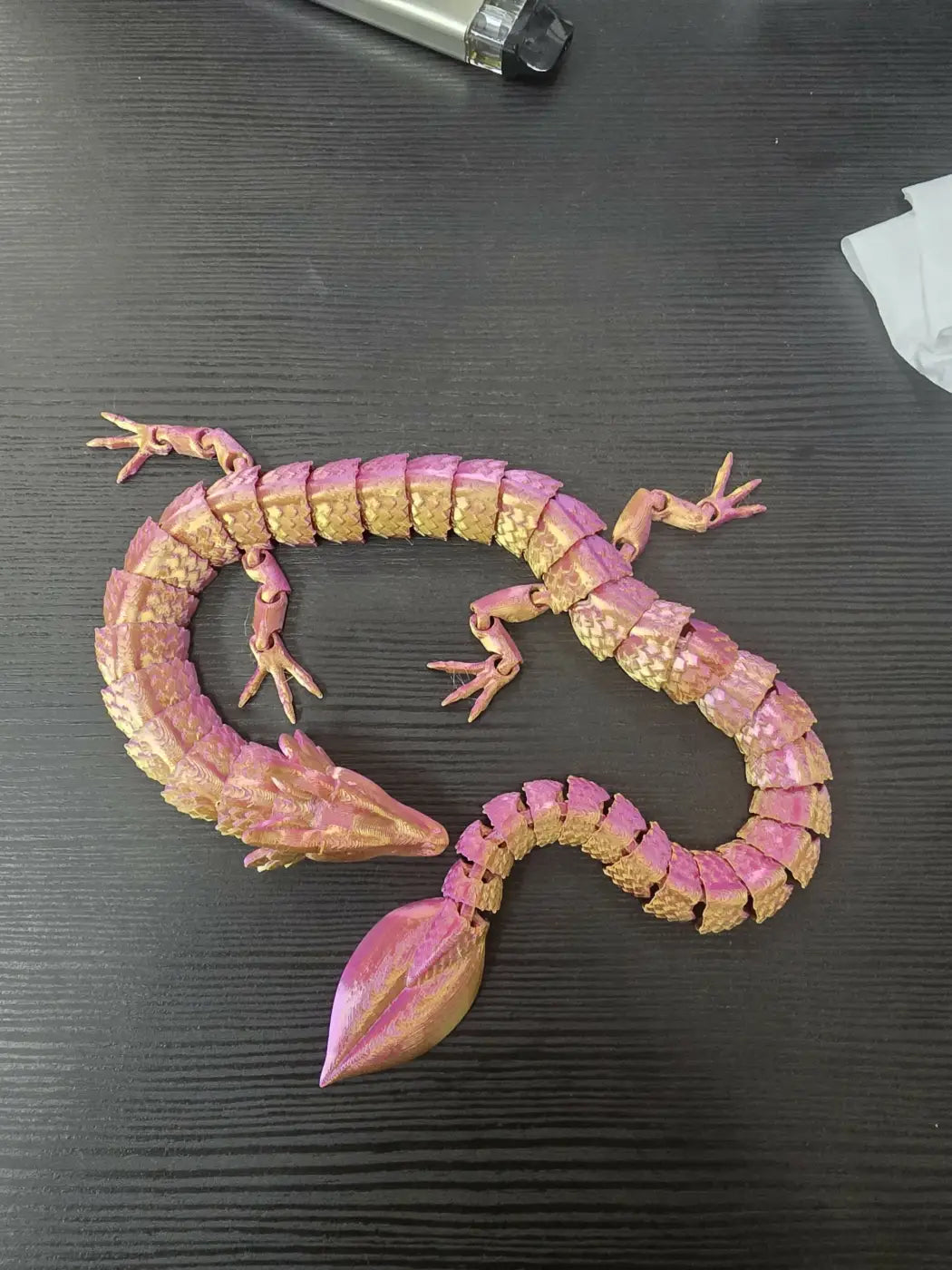 Large dragon figurine in pink and gold with articulated joints, ideal for collectors and natural skincare canada decor