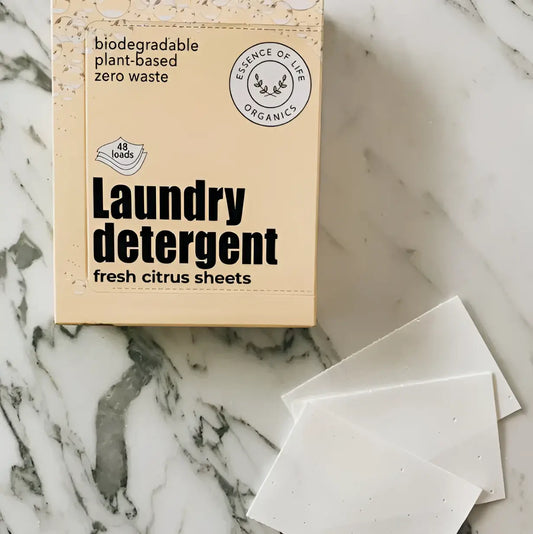 Beige box of essence of life organics laundry detergent sheets with white plant-based cleaning tablets for natural skincare canada