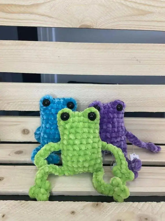 Green crocheted leggy frogs toy with black bead eyes and textured fuzzy fabric for pure wash handmade soap canada use