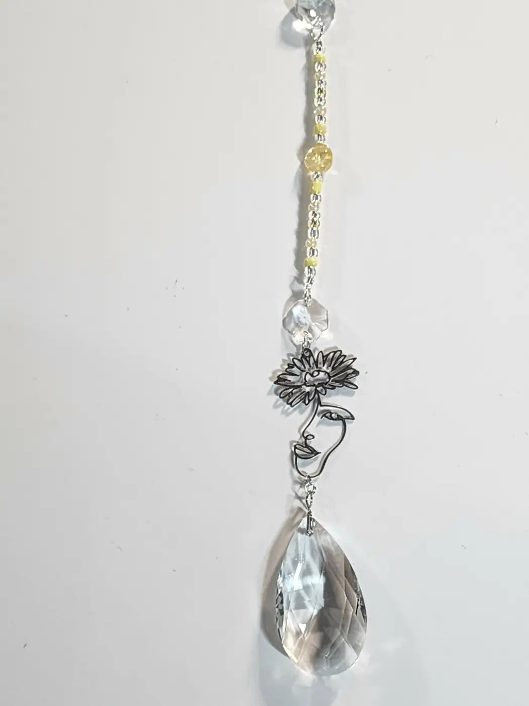 Long 2 delicate silver wire face sculpture with sunflower on crystal suncatcher chain with beads for suction cup in direct sunlight