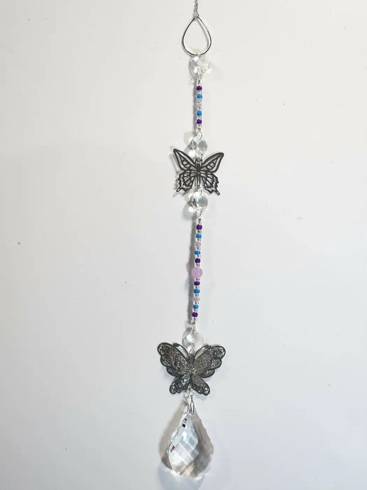 Long 4 butterfly-themed suncatcher with silver-toned metal, crystal beads, and suction cup for direct sunlight display
