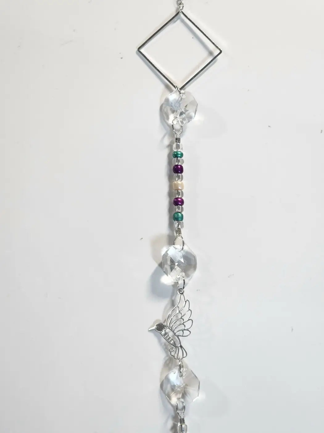 Long 8 delicate silver hummingbird suncatcher with clear crystal beads and diamond-shaped metal top for direct sunlight use