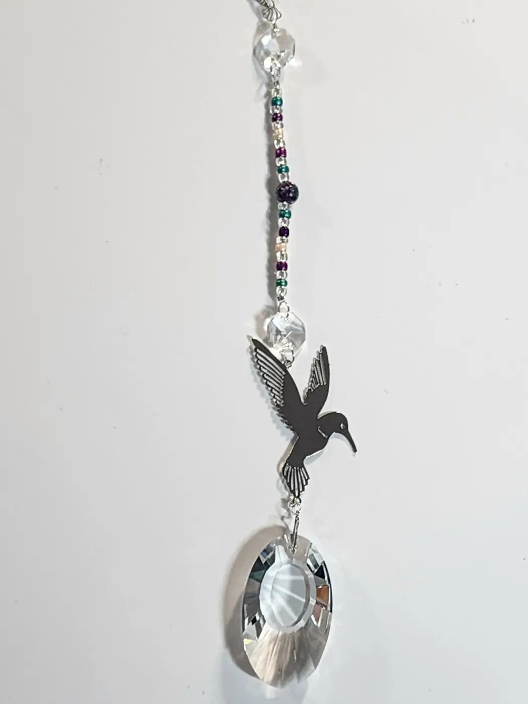 Long 8 sleek black hummingbird suncatcher with silver metal frame and beads for direct sunlight display with suction cup