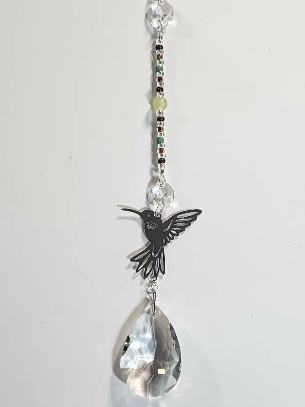 Long 9 black hummingbird metal charm with green beads and teardrop crystal ideal near direct sunlight suction cup displays