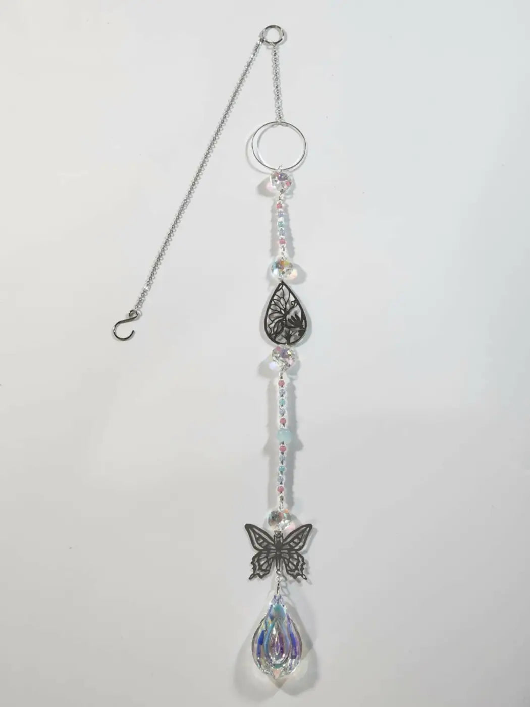 Long suncatcher with silver chain, black leaf and butterfly charms, clear beads, ideal for direct sunlight display