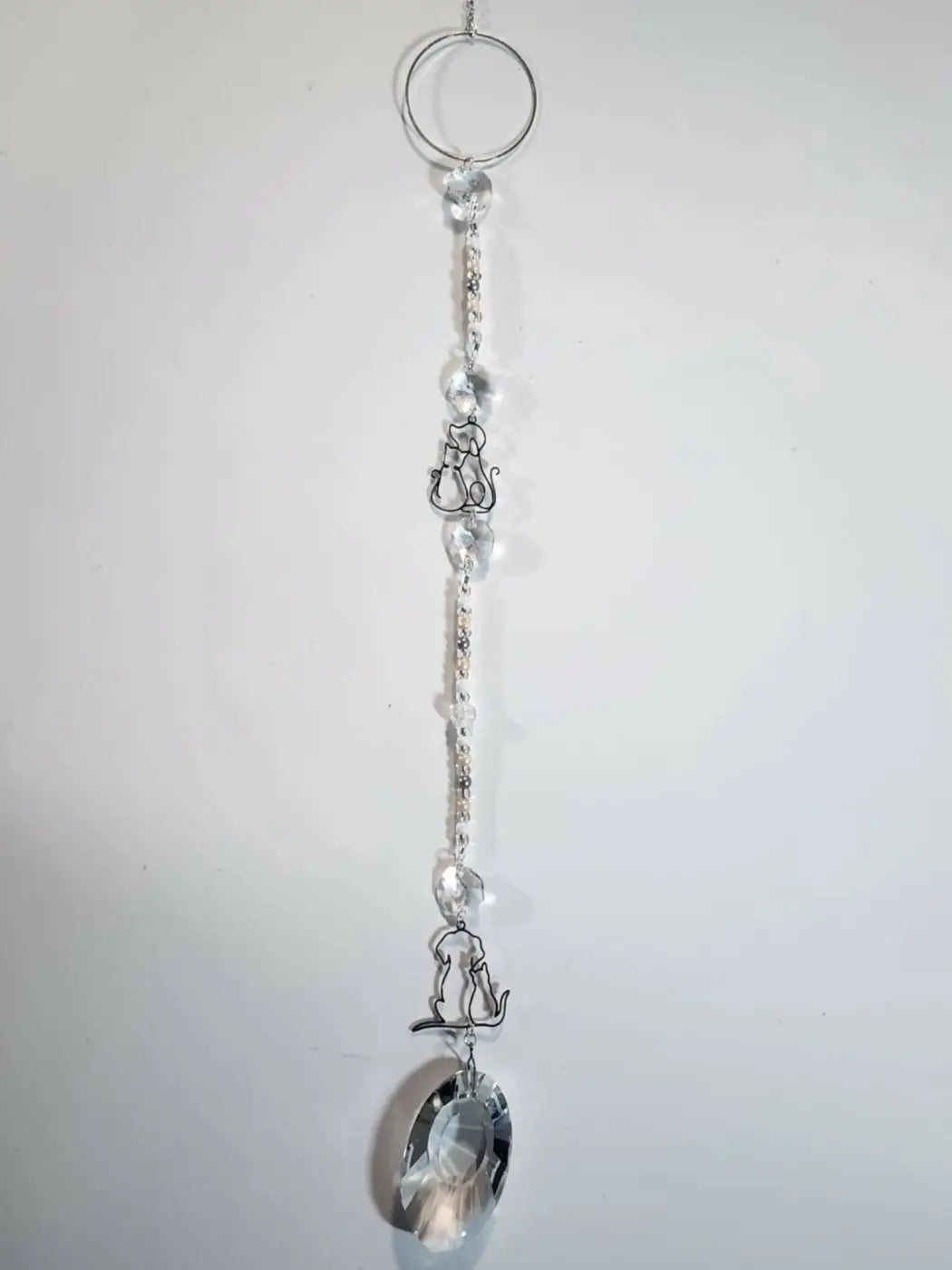 Long suncatcher with silver-toned cats and clear crystals designed to catch direct sunlight, handmade soap canada gift
