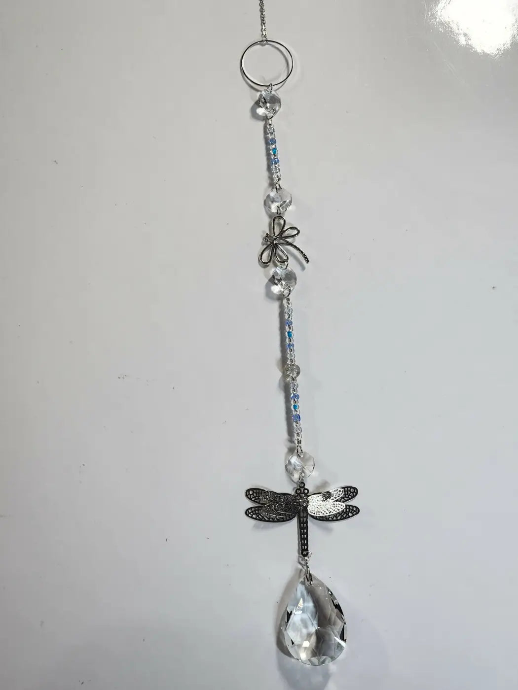 Delicate silver dragonfly long suncatcher with clear crystal beads and teardrop crystal ideal for direct sunlight