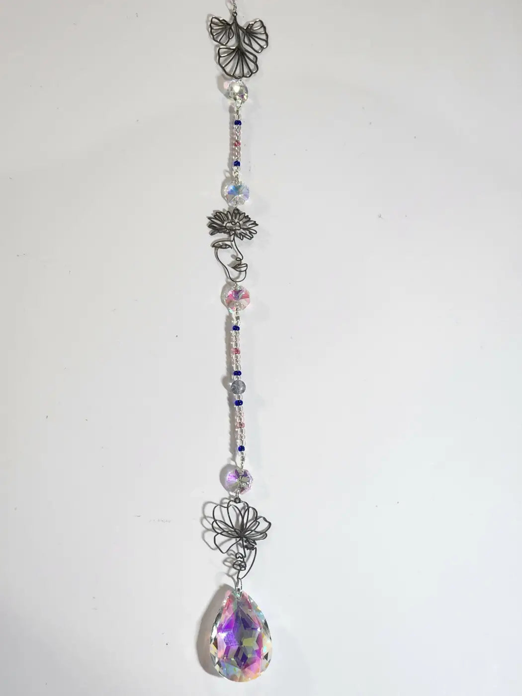 Long suncatcher made of silver wire with clear iridescent beads and teardrop crystal for direct sunlight display