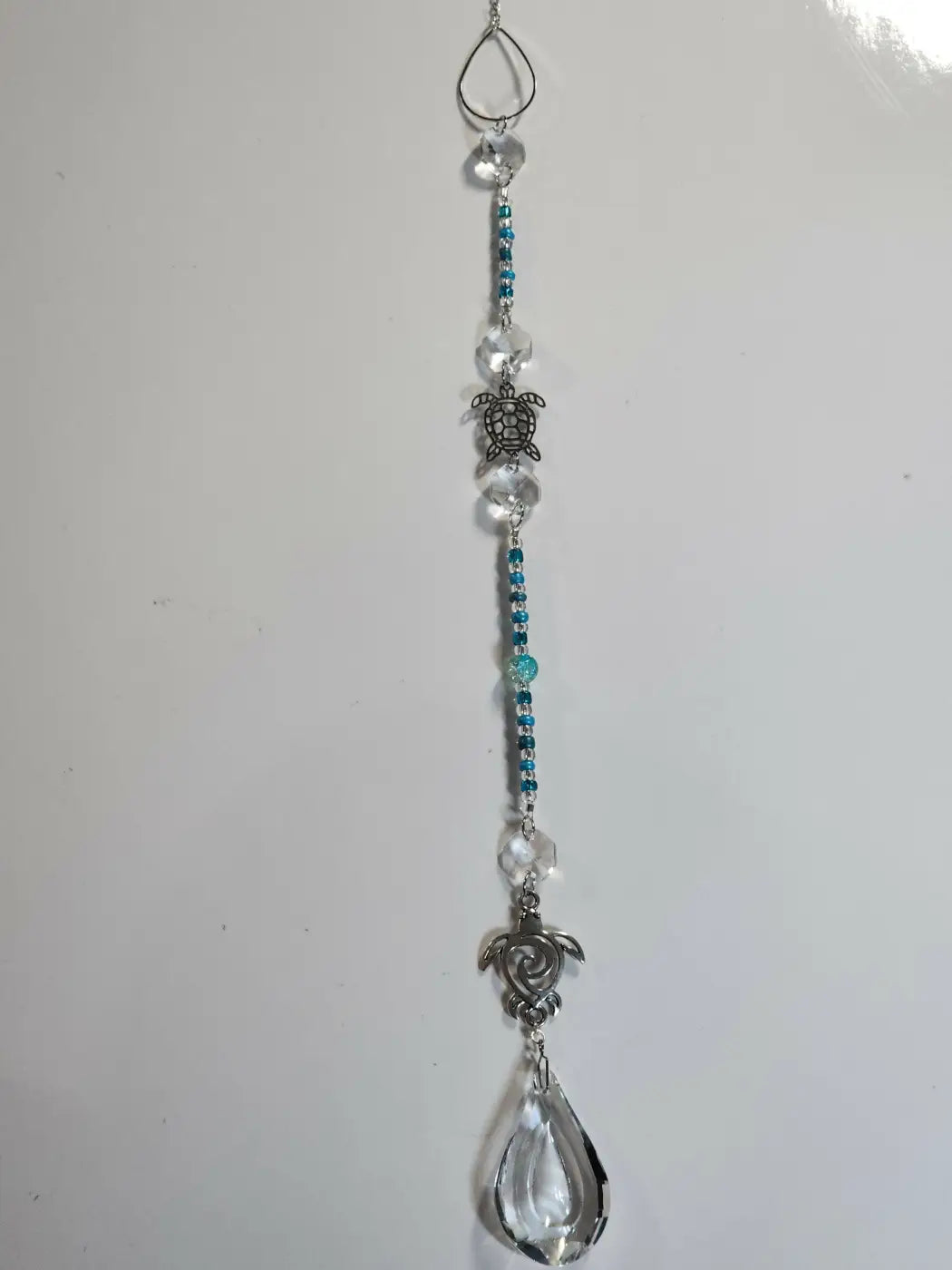 Long suncatcher with silver turtle charms, clear and teal beads, teardrop crystal, ideal for suction cup in direct sunlight