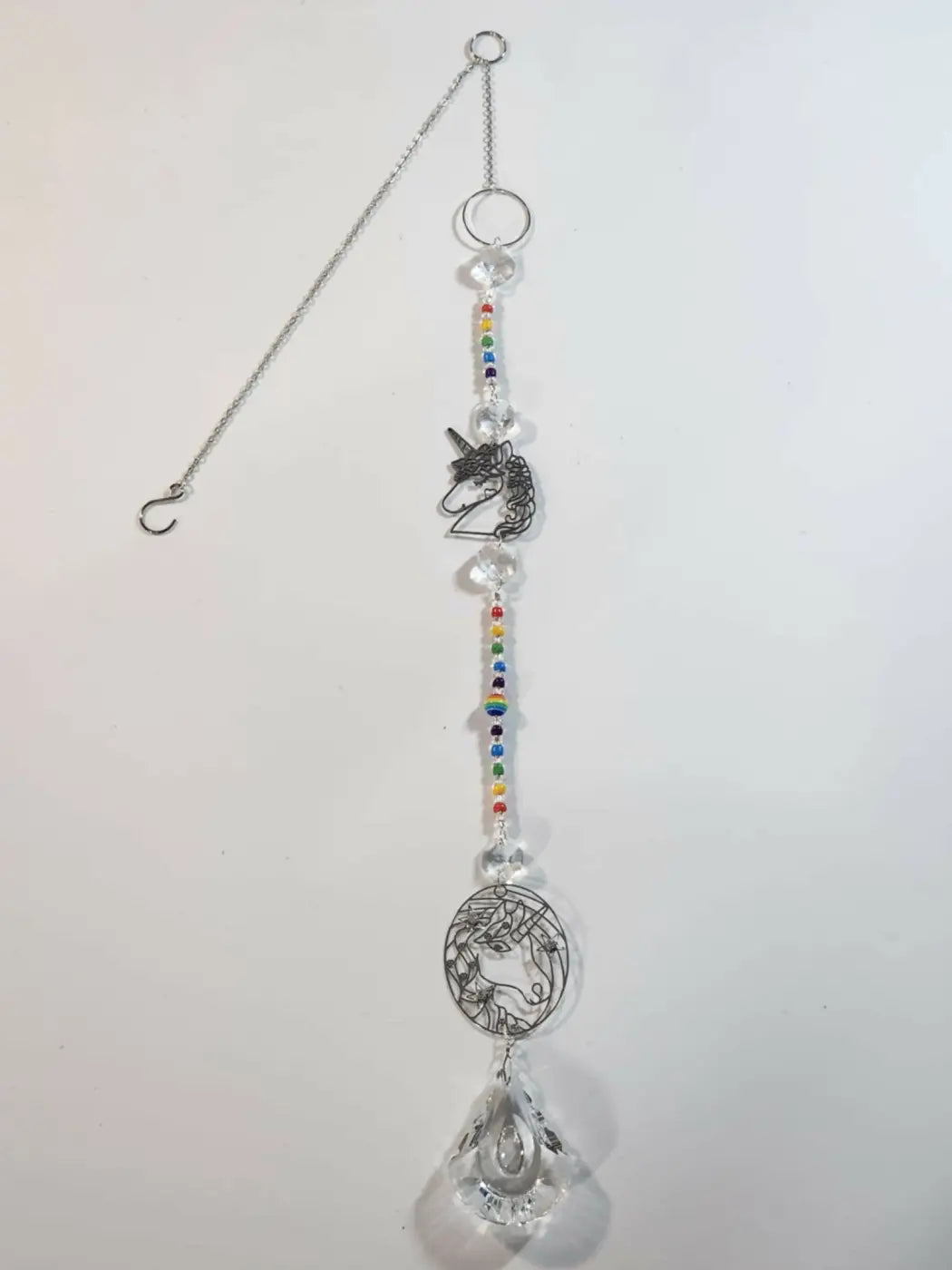 Long suncatcher featuring a delicate silver unicorn design with clear crystal beads and a teardrop prism for direct sunlight