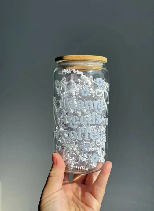 Clear glass coffee cup with bamboo lid and etched floral design featuring mama needs coffee and glass straw option