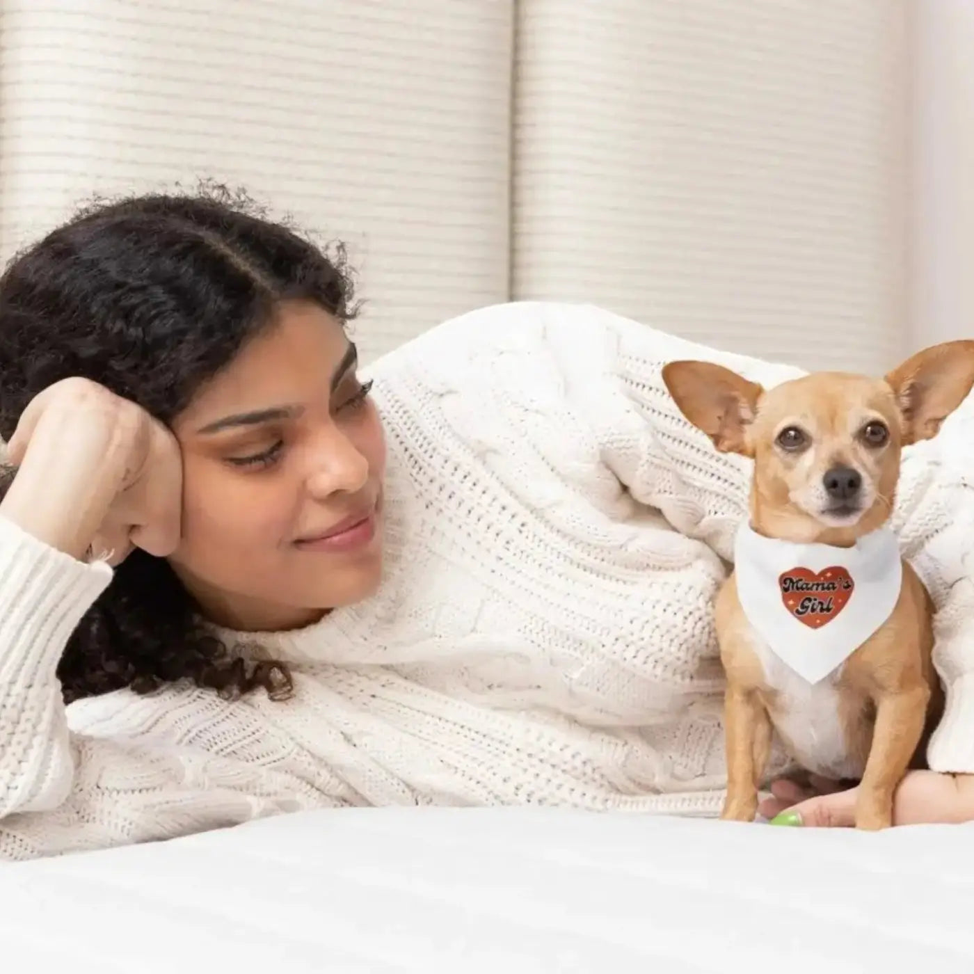 A tan chihuahua wearing a mama’s girl soft white girl dog bandana with orange heart stylish pet accessory