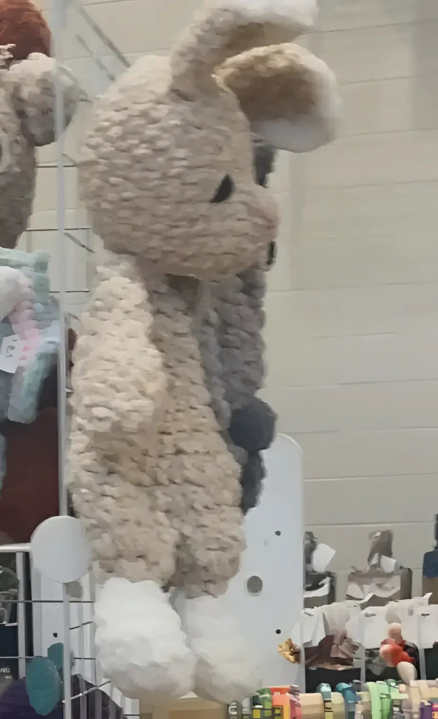 A handmade medium lovey cream-colored knitted rabbit with soft fur and black embroidered eyes perfect for pure wash use