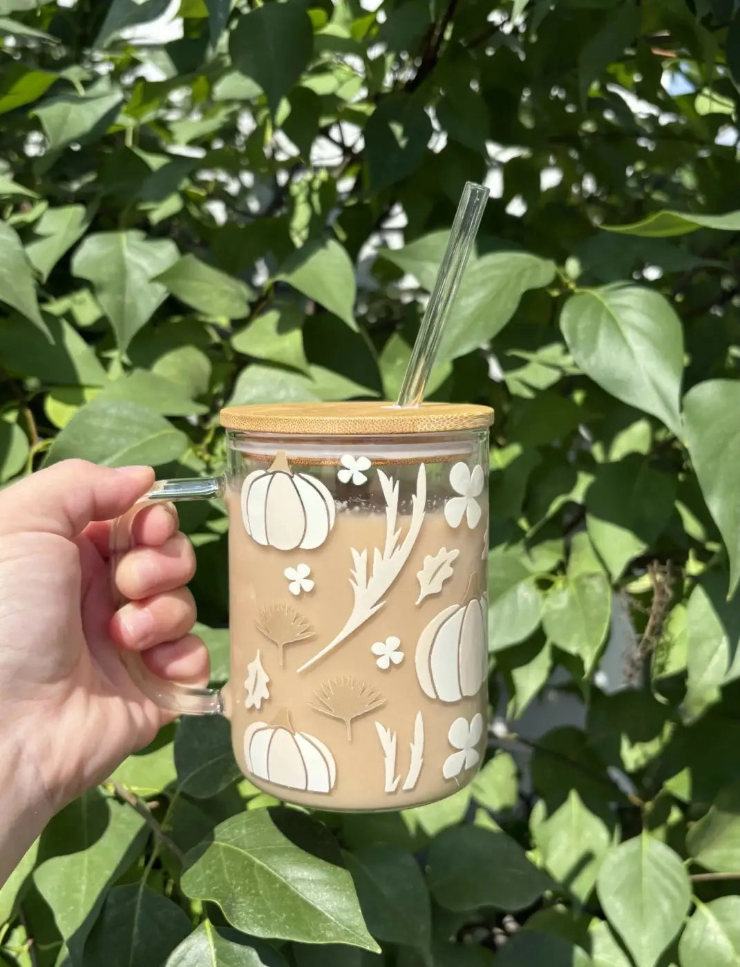 Clear glass neutral pumpkin mug with white pumpkin decals and bamboo lid and handle dishwasher safe design