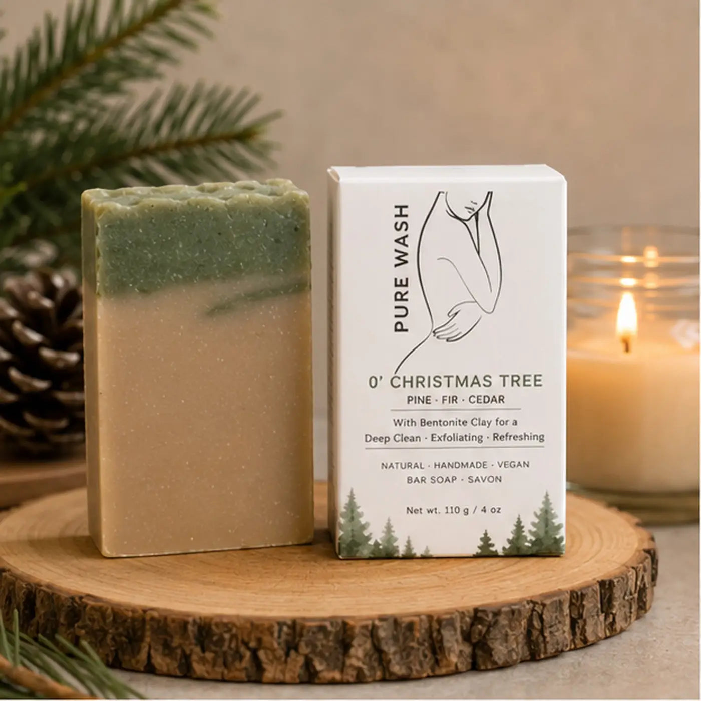 A two-toned rectangular soap bar with green and beige layers beside white pure wash 0 christmas tree packaging for fresh pine christmas use