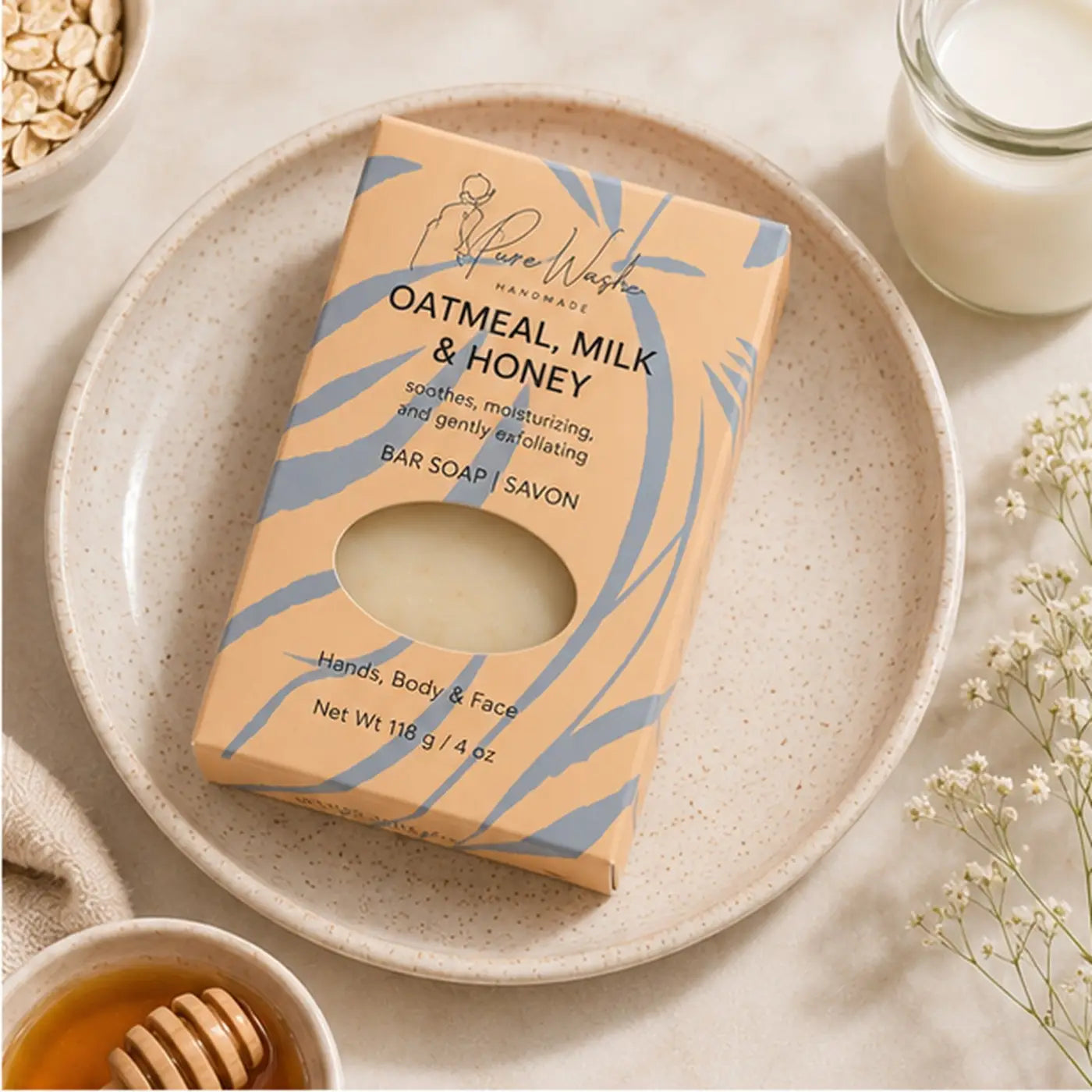 A beige and blue patterned box of pure wishes handmade oatmeal milk and honey soap ideal for dry skin care
