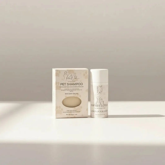 A minimalist white pet bundle with neem oil bar shampoo and pawsies lotion bar featuring silver foil detailing
