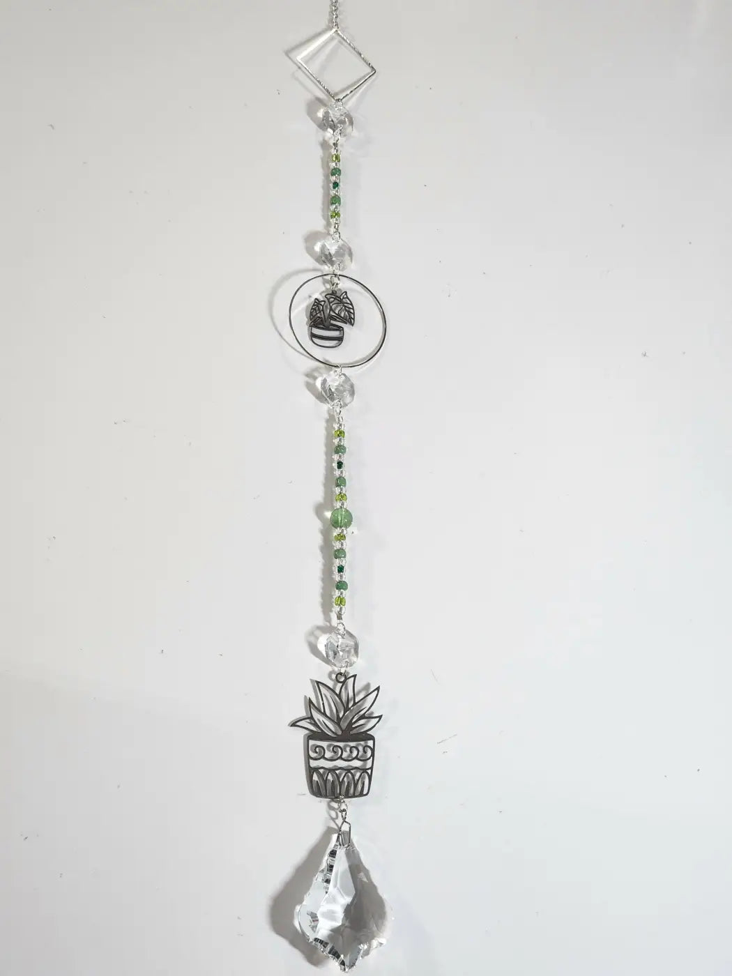 Silver-toned plant long suncatcher with clear crystal and green beads featuring potted plant charms and teardrop crystal