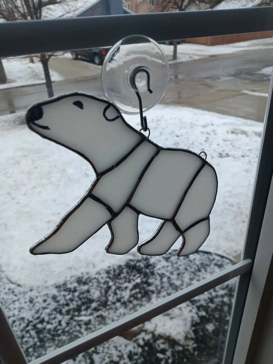 White glass polar bear stained glass window hanging with black outlines and clear suction cup attachment