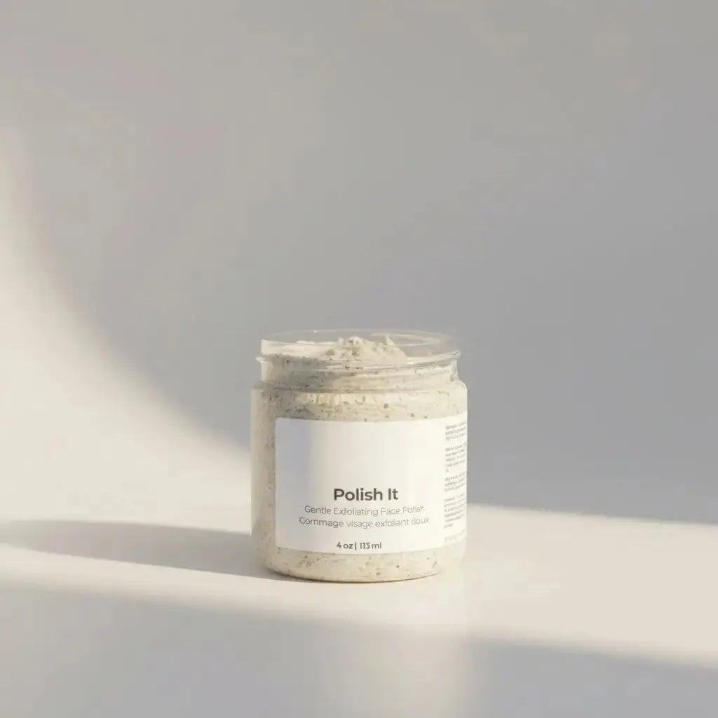 A clear glass jar of polish it creamy exfoliant with light beige speckled texture for dead skin with cucumber seed oil