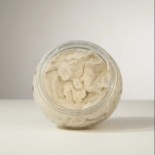 A clear glass jar filled with creamy off-white polish it creamy exfoliant refill for natural skincare canada and pure wash