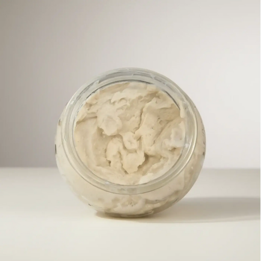 A clear glass jar filled with creamy off-white polish it creamy exfoliant refill for natural skincare canada and pure wash
