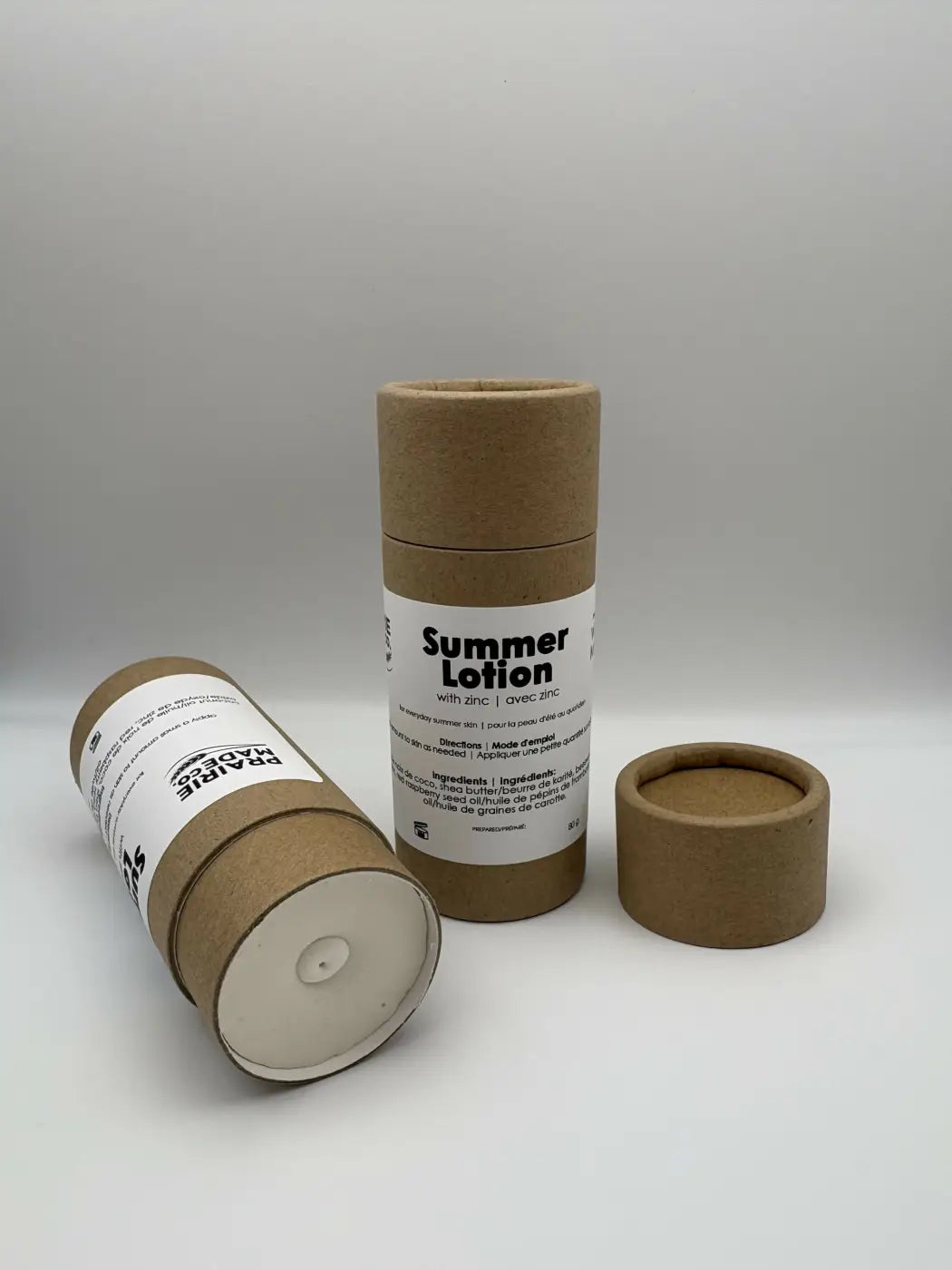 Brown cardboard tube packaging with white label and lid for prairie made summer lotion with zinc natural skincare canada