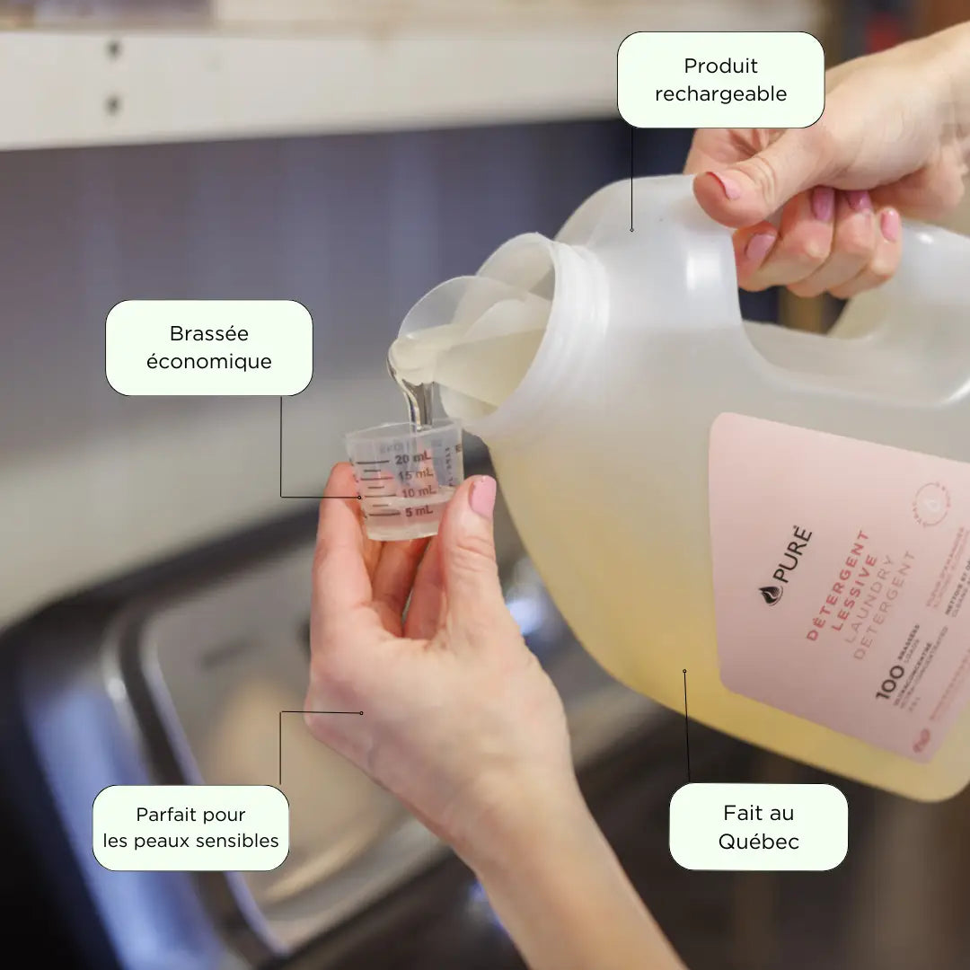 Pale yellow Almond Blossom laundry detergent in a large white refill jug with a pink Pure Wash label