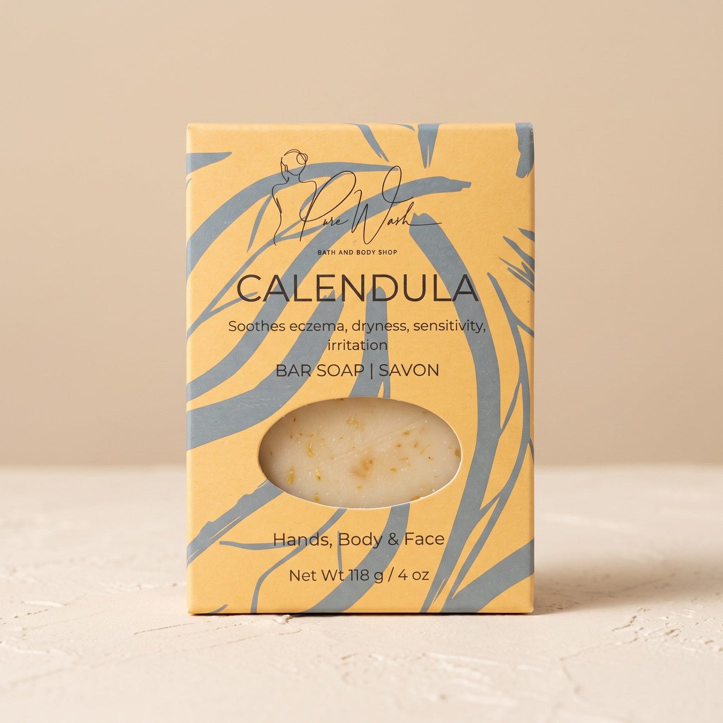 Pure Wash calendula soap bar in yellow patterned packaging for sensitive skin with visible dried flower petals