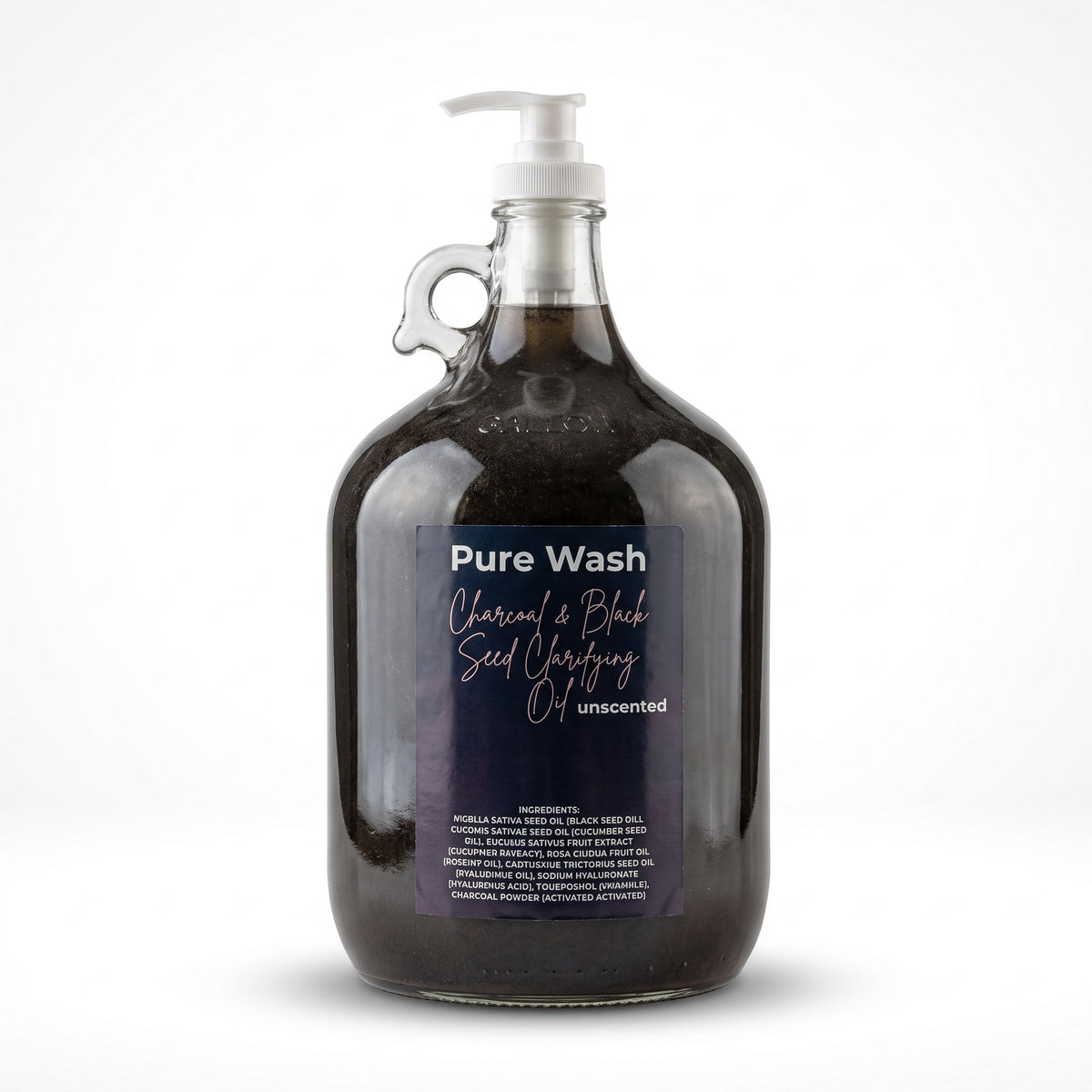 Pure Wash charcoal and black seed clarifying oil in a large glass refill jug with a white pump dispenser