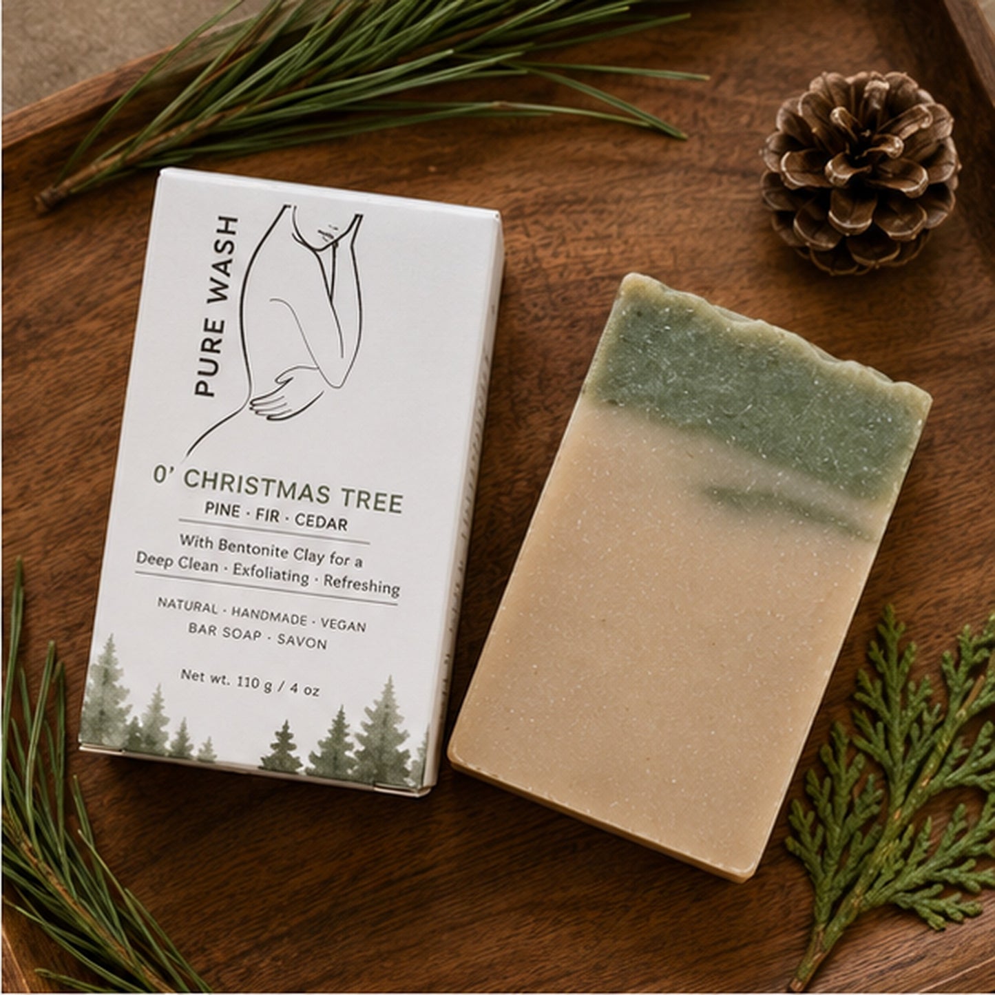 Pure Wash O’ Christmas Tree bar soap with pine scent, featuring a green and tan layered design on a wooden tray.