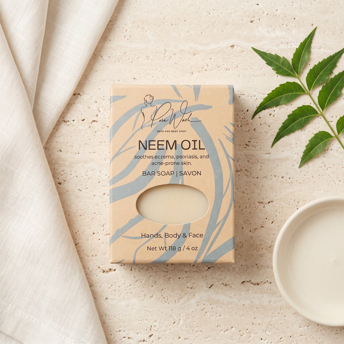 Pure Wash Neem Oil soap bar in eco-friendly packaging for sensitive skin, displayed with a neem leaf on stone.