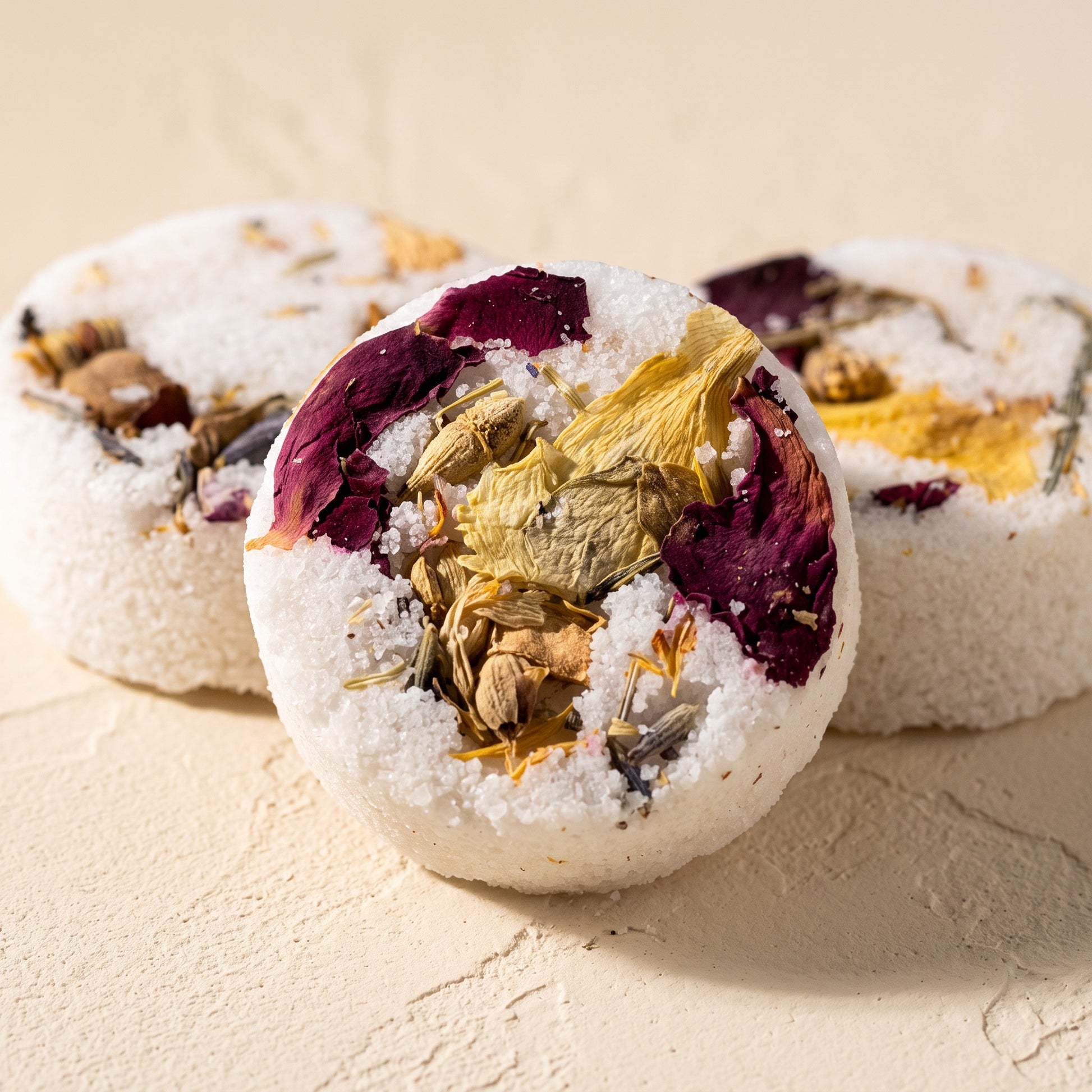 Pure Wash Pedi Bombs featuring dried flower petals and Epsom salt for a relaxing at-home spa foot soak experience.
