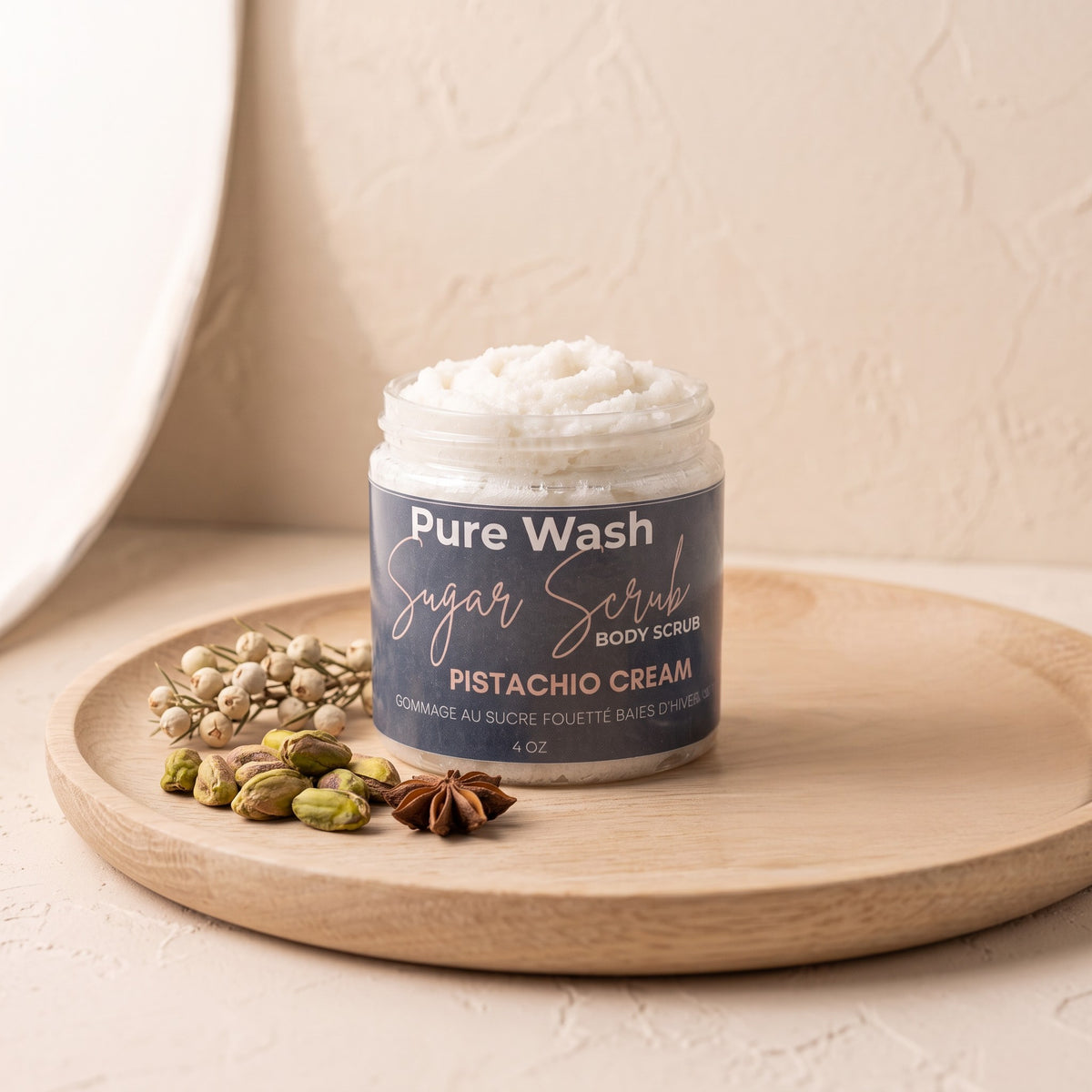 Pure Wash Pistachio Cream body sugar scrub in a jar with shea butter and avocado oil on a wooden tray
