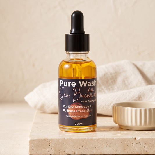 Pure Wash Sea Buckthorn facial oil in a glass dropper bottle for dry, sensitive, and redness-prone skin.