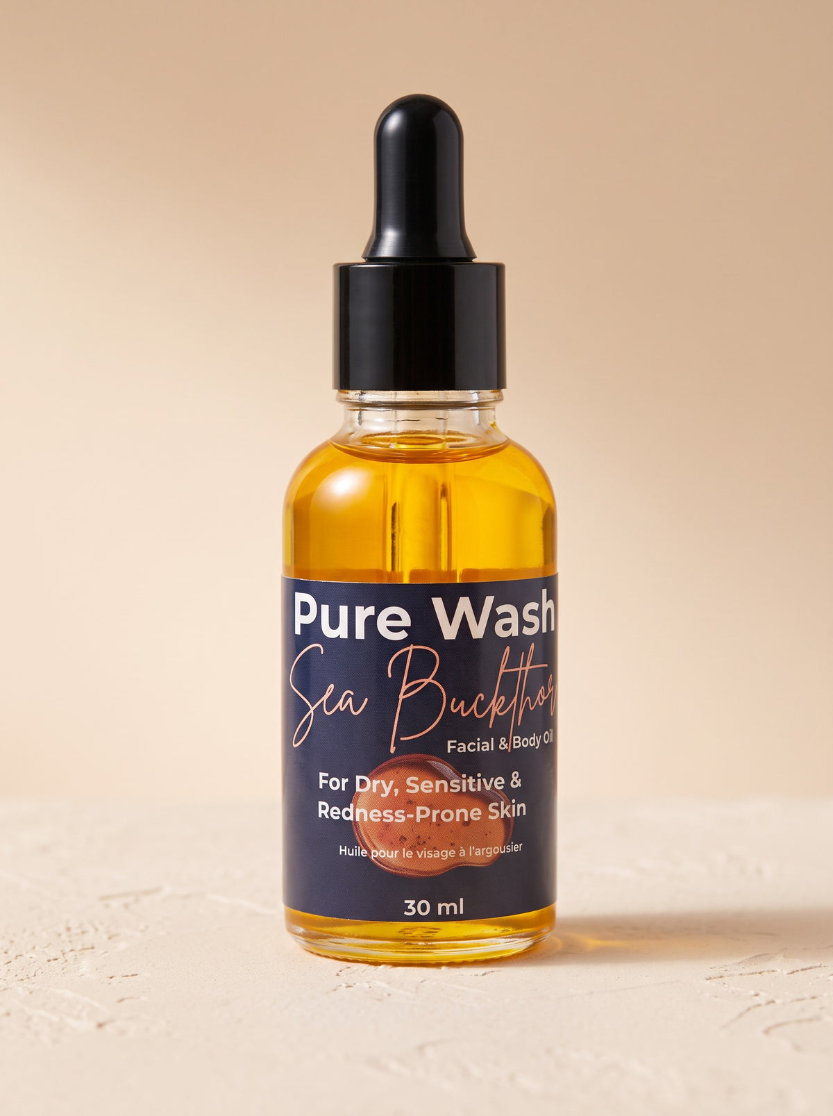 Pure Wash Sea Buckthorn facial oil in a glass dropper bottle for dry, sensitive, and redness-prone skin.