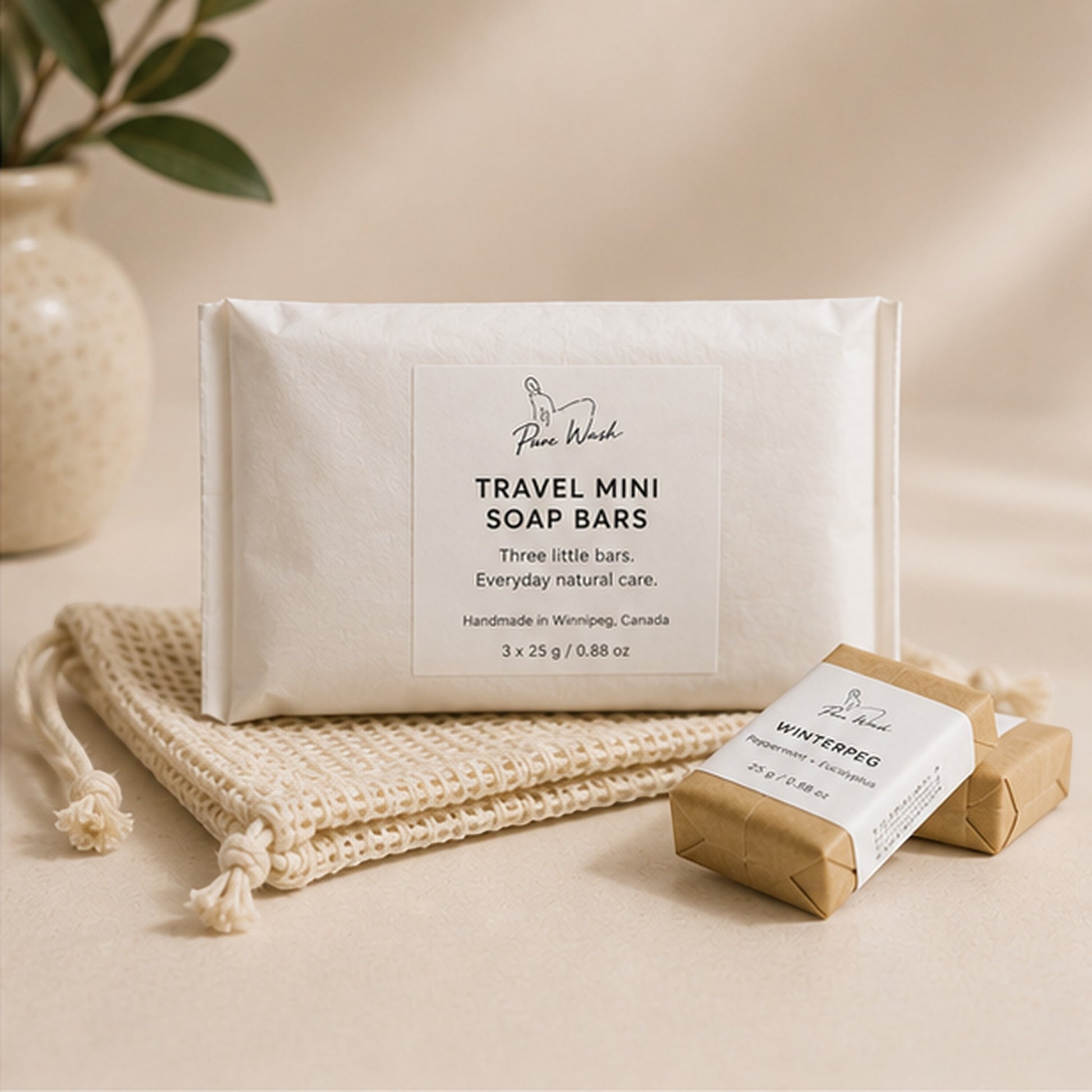 Pure Wash travel mini soap bars in eco-friendly kraft paper packaging with a reusable exfoliating soap bag.