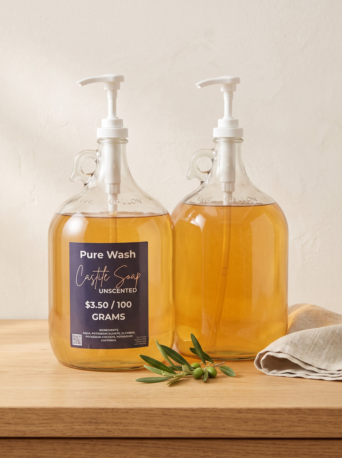 Two Pure Wash one-gallon glass jugs of unscented concentrated castile soap with pump dispensers on a wooden table.