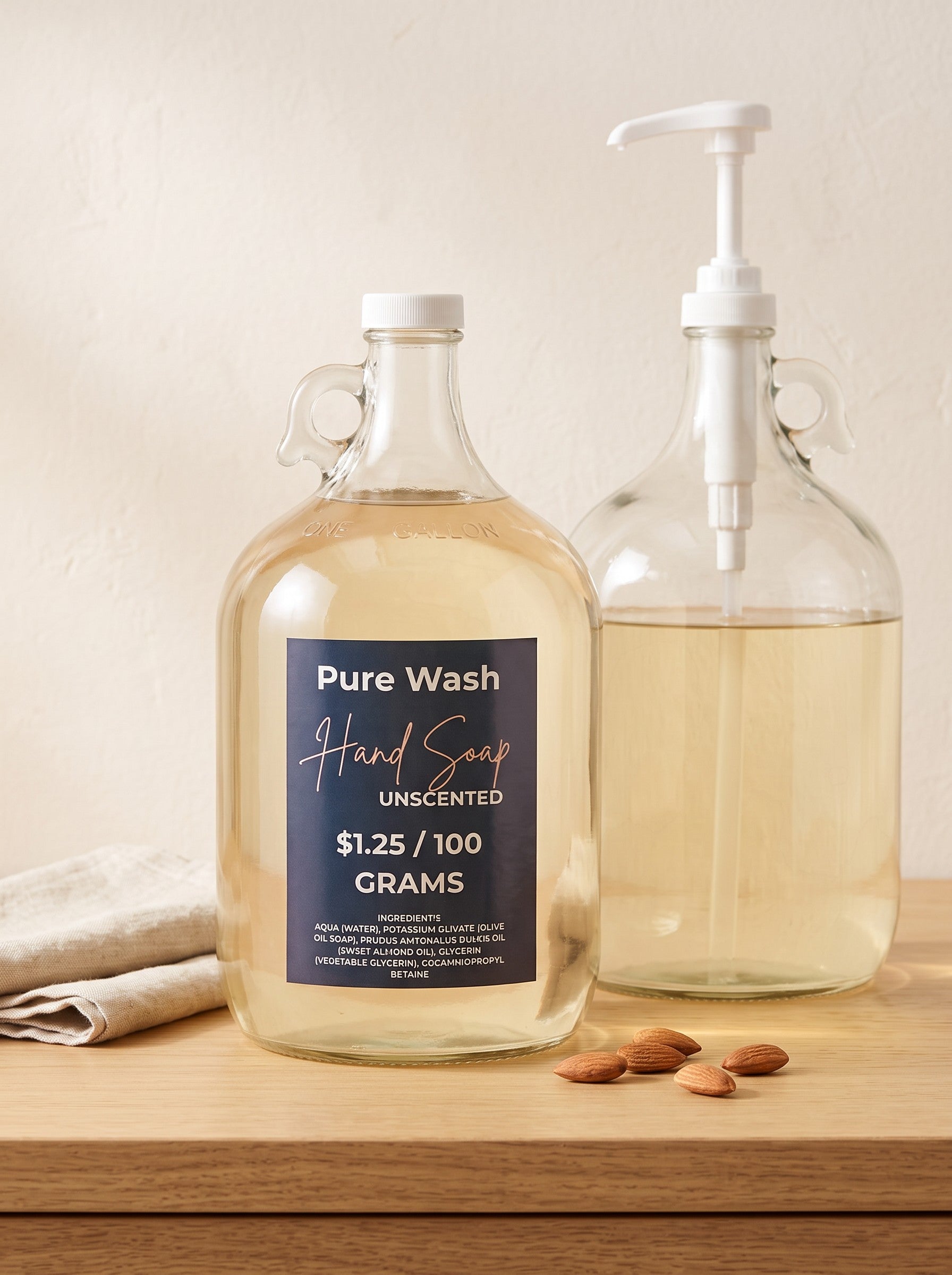 Pure Wash unscented plant-based liquid hand soap in large glass refill jugs on a wooden surface with almonds.