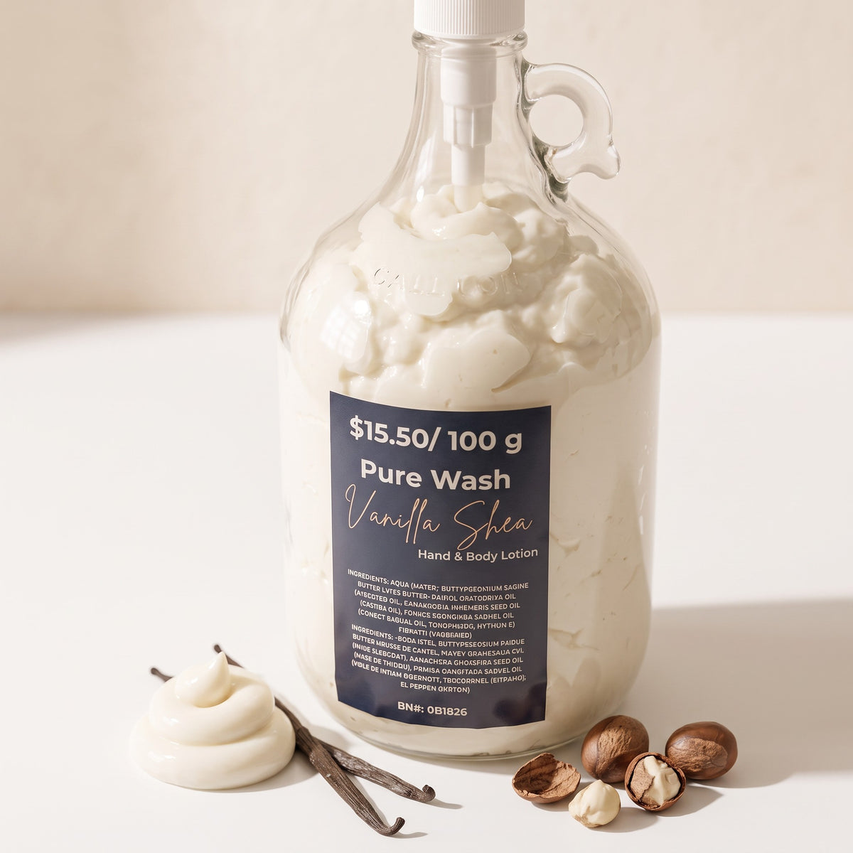 Pure Wash vanilla shea body lotion in a glass refill jug with shea nuts and a vanilla bean on a white surface.