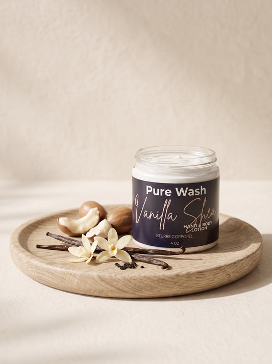 Pure Wash Vanilla Shea body and hand lotion in a glass jar on a wooden tray with vanilla beans and shea nuts.