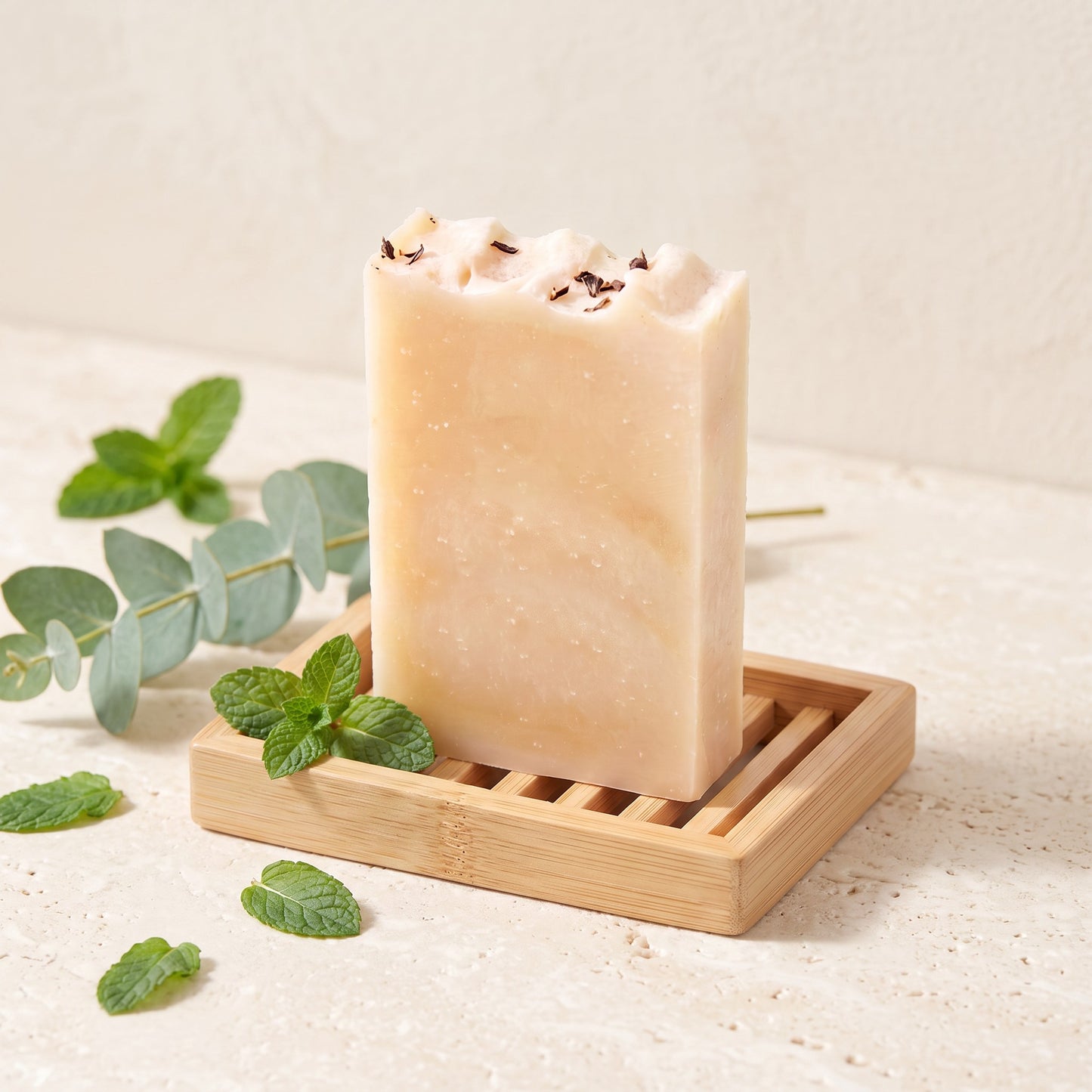 Pure Wash WinterPeg soap bar with peppermint and eucalyptus on a bamboo dish with fresh mint leaves