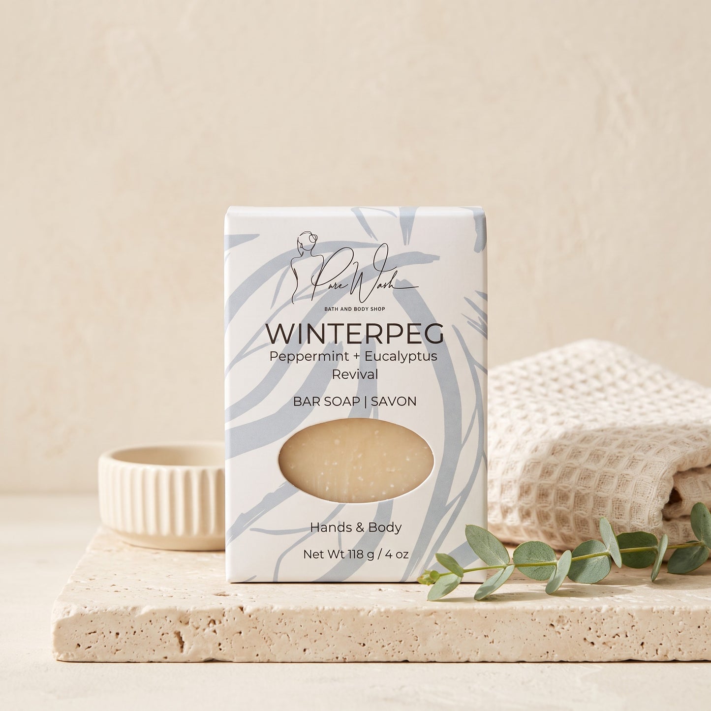 Pure Wash WinterPeg soap bar with peppermint and eucalyptus scent in decorative packaging on a stone tray.
