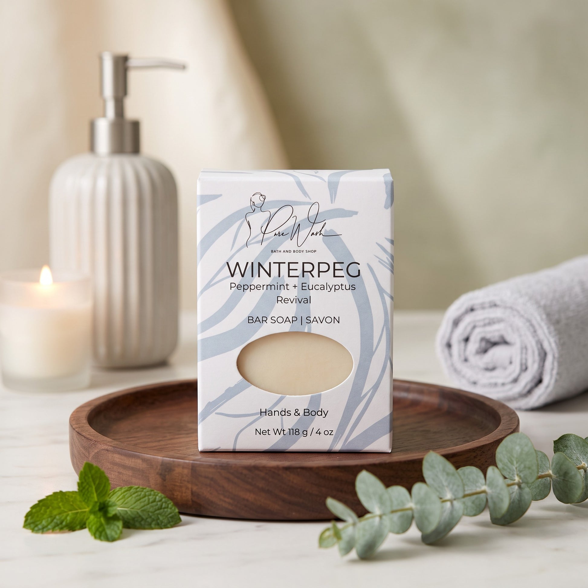 Pure Wash WinterPeg peppermint and eucalyptus soap bar in decorative packaging on a wooden tray with eucalyptus sprig