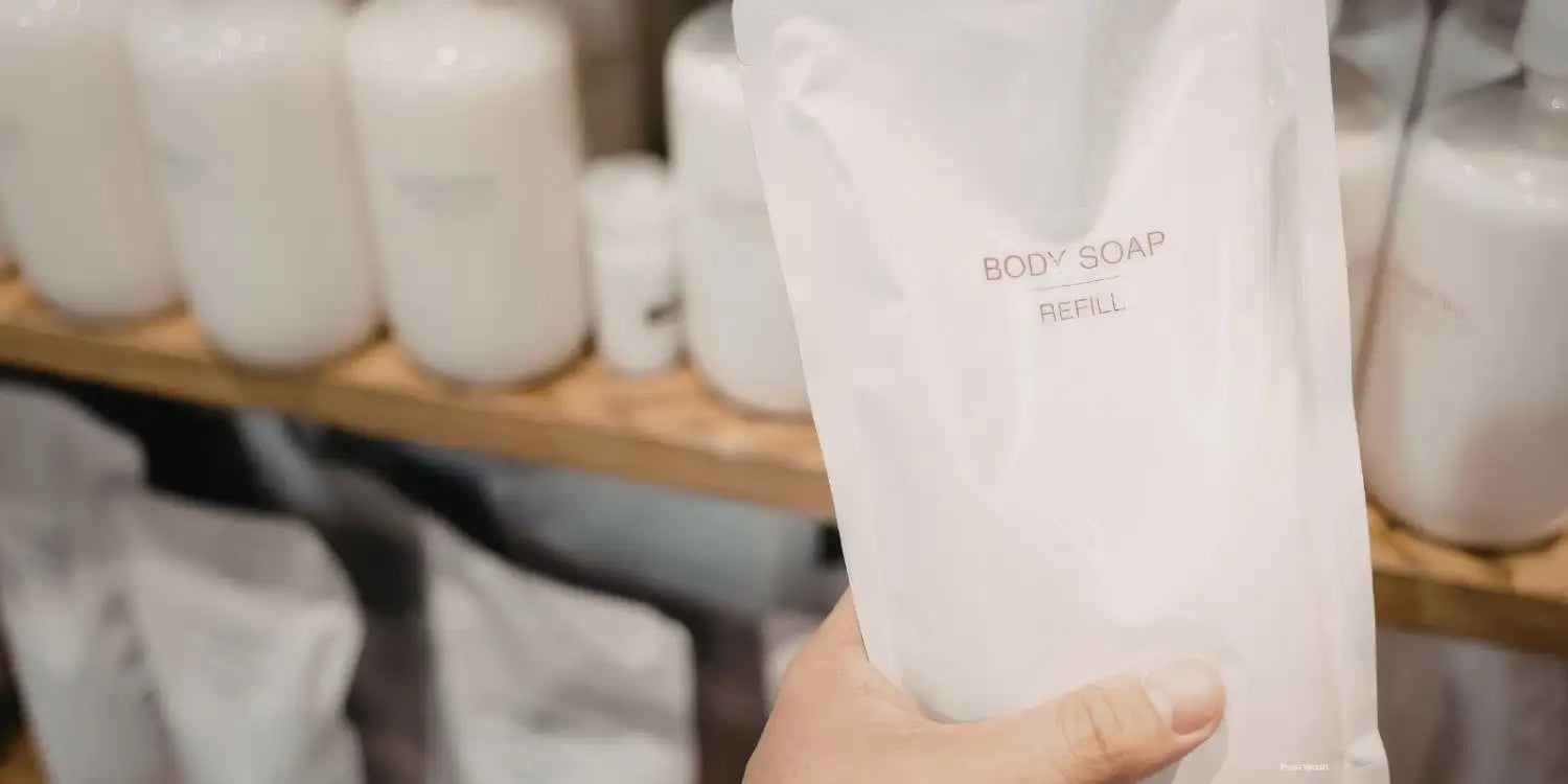 A translucent white refill pouch for body soap, labeled with minimalist black text