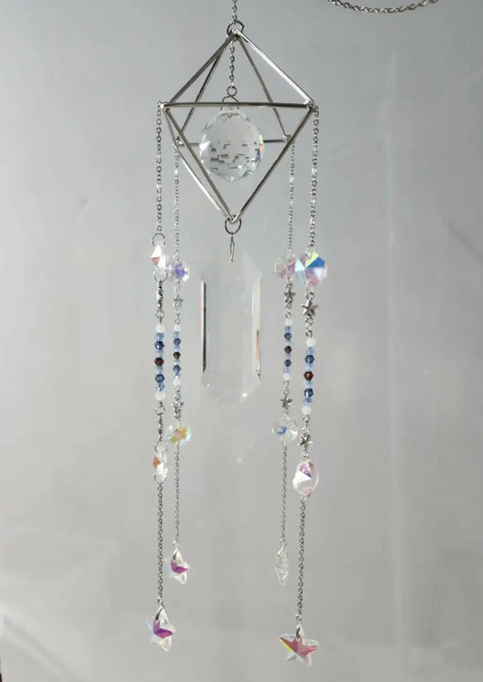 Pyramid suncatcher featuring a delicate silver geometric frame with a crystal orb and iridescent bead charms, canadian made skincare