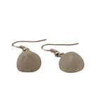 Delicate rose quartz earrings feature smooth translucent stones suspended from sleek silver fishhook clasps handcrafted earrings feature