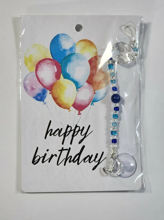 Small BD moon suncatcher featuring a silver crescent charm with a clear pendant and blue transparent beads
